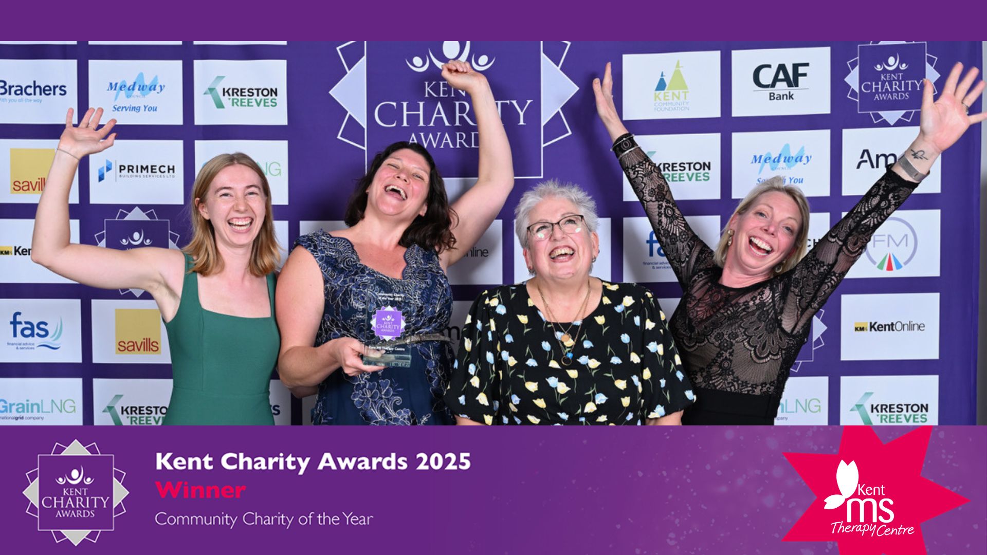 The fundraising team, vice chair and CEO celebrate whilst holding the award.
