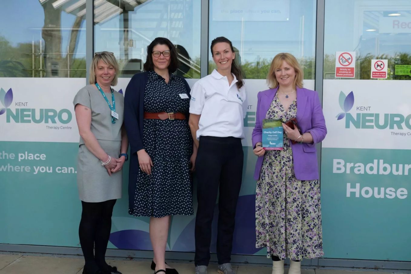 Four women stand outside Kent Neuro Therapy Centre. Left to right: Heidi Coleman (CEO) Nancy Reed (Head of Income Generation) Hazel Wallis (Clinical Lead) Rosie Duffield (MP)