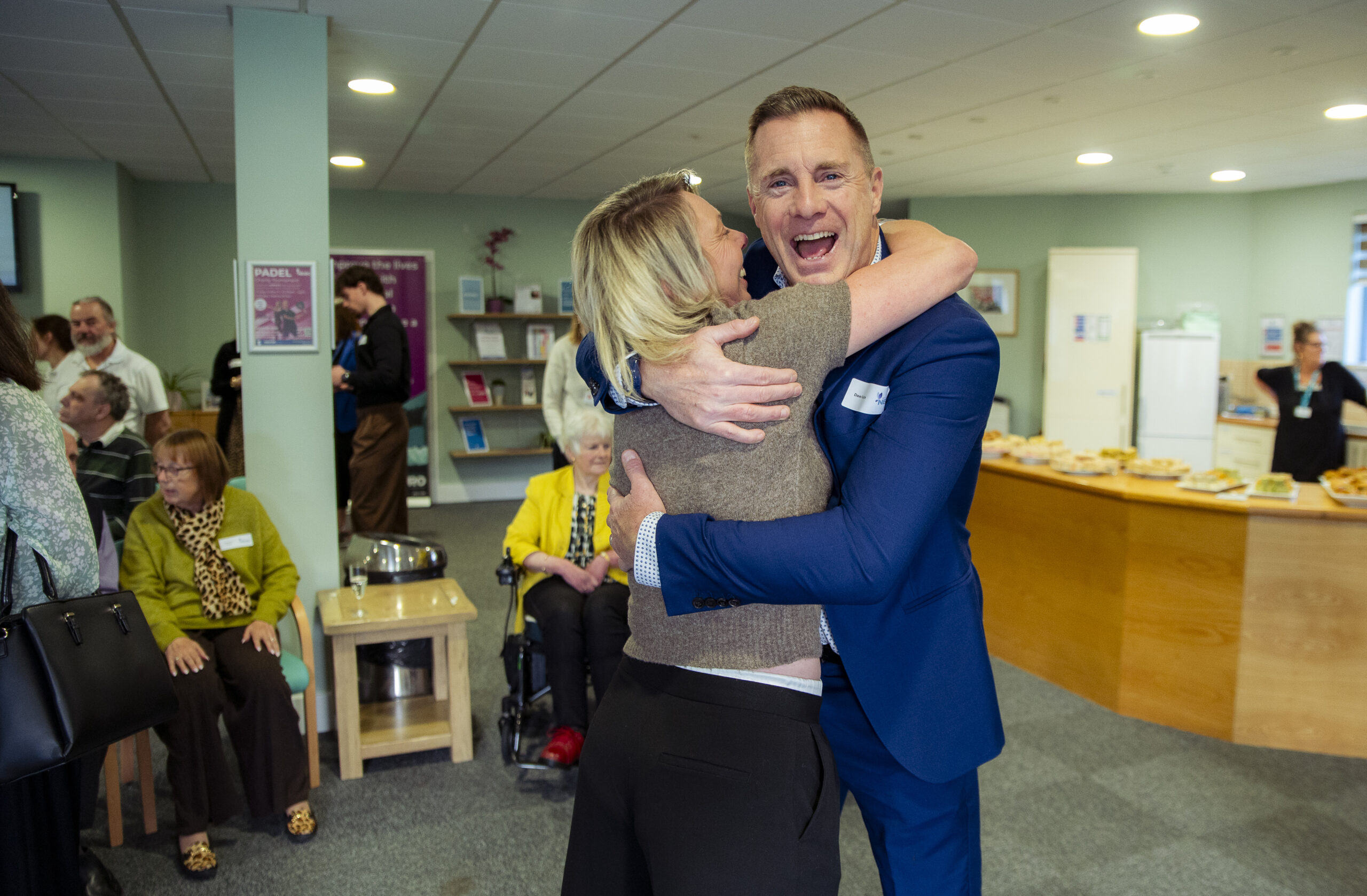 Supporter and staff celebrating at the Kent Neuro Therapy Centre