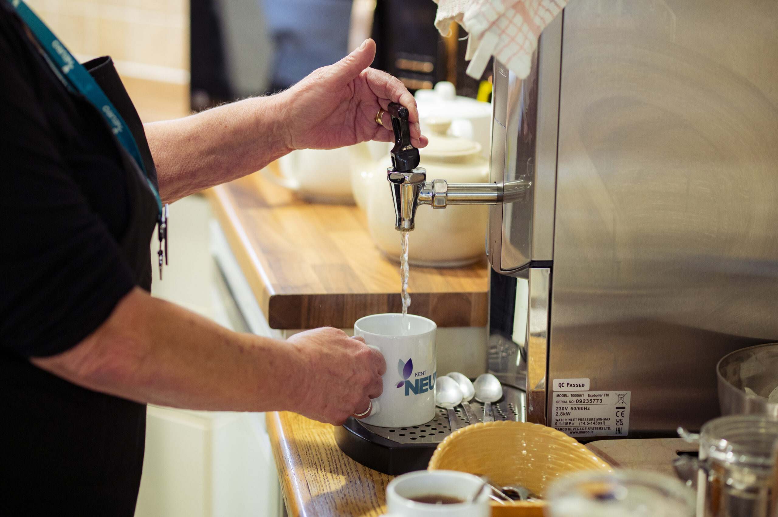Volunteer making a cup of tea at Kent Neuro Therapy Centre